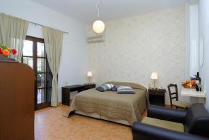 A bed or beds in a room at Enalion Hotel