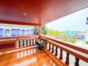 a balcony with a view of a building at Hostel Banamphur - Sleep like a baby in Na Jomtien