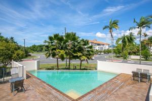 a swimming pool in the middle of a building at Belle Escapes Waterview Penthouse 404 The Edge in Cairns