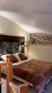 Postel nebo postele na pokoji v ubytování Le Camélia