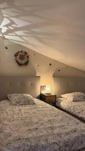 Postel nebo postele na pokoji v ubytování Le Camélia