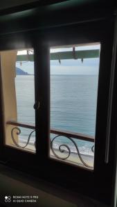 a view of the ocean from a window at Blue Windows in Camogli