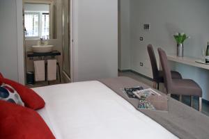 A bed or beds in a room at Gregori Guest House