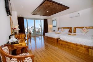 Giường trong phòng chung tại Rex Hotel & Apartment