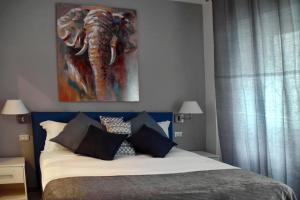 A bed or beds in a room at Gregori Guest House