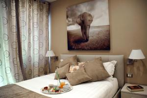 A bed or beds in a room at Gregori Guest House