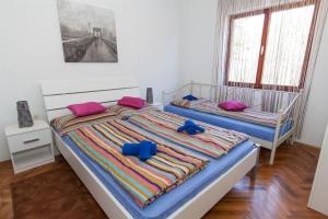 Postel nebo postele na pokoji v ubytování Apartments Vita