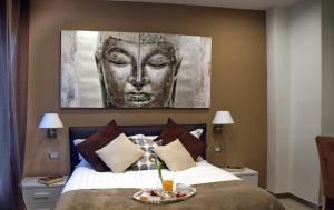 A bed or beds in a room at Gregori Guest House