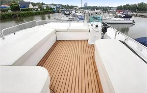 a deck of a boat in a marina with boats at Pet Friendly Ship In Havelsee Ot Ktzkow With Sauna in Neuruppin