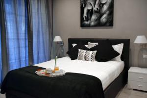 A bed or beds in a room at Gregori Guest House