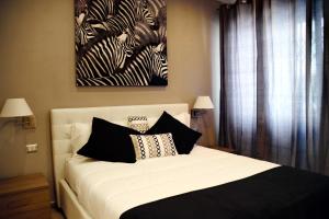 A bed or beds in a room at Gregori Guest House