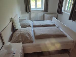 Postel nebo postele na pokoji v ubytování Ferienhaus Temmel