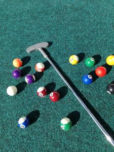 a group of billiard balls on the green felt at Relax tiny villas 40 meters of the beach in Korčula