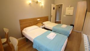 Posteľ alebo postele v izbe v ubytovaní Paraiso Hostel