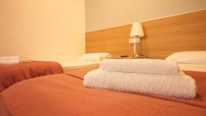 Posteľ alebo postele v izbe v ubytovaní Paraiso Hostel