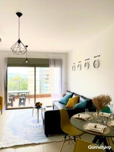 a living room with a couch and a table at • Spacious Apartment in Trendy Akko/Acre • in ‘Akko