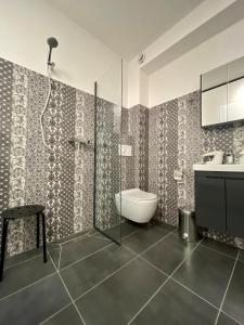 a bathroom with a shower and a toilet and a sink at SOHO Green Pristina Kosovo in Pristina