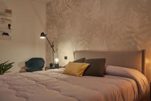 A bed or beds in a room at Bamboo Suite Zona Ripamonti-IEO