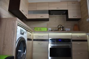 Kuchnia lub aneks kuchenny w obiekcie Apartament Centrum - Aleja Świętego Jana Pawła II