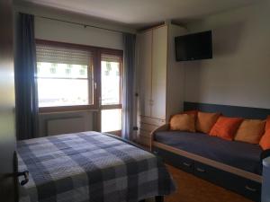 Postel nebo postele na pokoji v ubytování B&B DA ROBERTINO