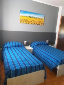 Postel nebo postele na pokoji v ubytování B&B DA ROBERTINO