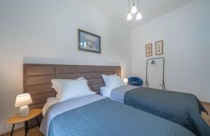 Tempat tidur dalam kamar di Main Square View