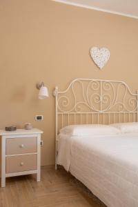 Letto o letti in una camera di Villa Santoro al Paradiso Verde, Villa intera con Piscina
