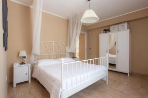 Letto o letti in una camera di Villa Santoro al Paradiso Verde, Villa intera con Piscina