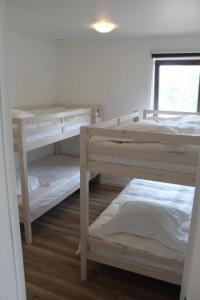 Postel nebo postele na pokoji v ubytování West Bay Familieappartement