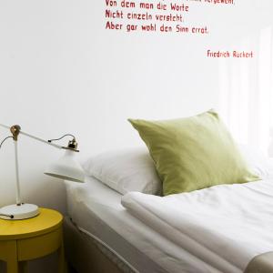 Łóżko lub łóżka w pokoju w obiekcie Hotel Villa Rückert