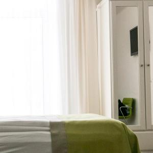 Łóżko lub łóżka w pokoju w obiekcie Hotel Villa Rückert