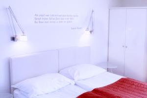 Łóżko lub łóżka w pokoju w obiekcie Hotel Villa Rückert
