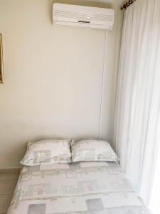 Ein Bett oder Betten in einem Zimmer der Unterkunft Keran 2+2