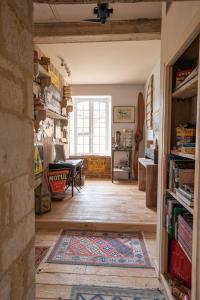 a living room with a rug on the floor at Maison Maleville in Domme