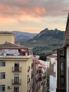 a view of a city with buildings and mountains at La Villa de Jaén - Catedral in Jaén