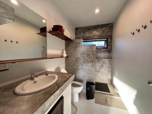 a bathroom with a sink and a toilet at KohTao Studios Sunset in Koh Tao