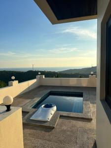 a swimming pool on the roof of a house at KohTao Studios Sunset in Ko Tao