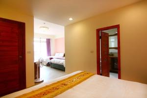 Postelja oz. postelje v sobi nastanitve Yilan B&B - Happy Snail