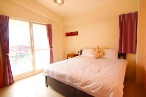 Postelja oz. postelje v sobi nastanitve Yilan B&B - Happy Snail