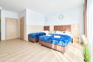 Posteľ alebo postele v izbe v ubytovaní Villa Polna