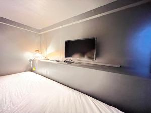 TV a/nebo společenská místnost v ubytování Rhodes Otsuka Hotel