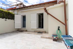 a house being remodeled with a patio at Casa L - Mimbelli Park Modern Quiet Apartment in Livorno
