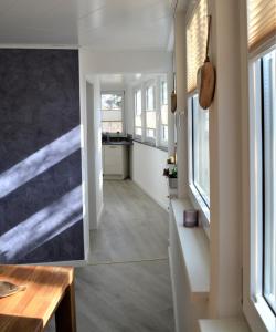 a hallway of a house with a painting on the wall at Auszeitoase in Olsberg