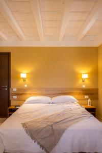 Cascina Bagaggera客房内的一张或多张床位