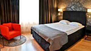 Giường trong phòng chung tại Hotel Amadeus by First