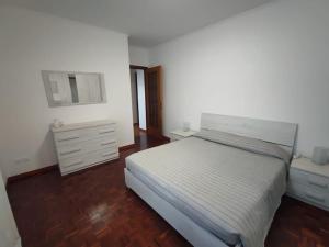 Un ou plusieurs lits dans un hébergement de l'établissement Appartamento vista panoramica