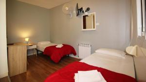 Posteľ alebo postele v izbe v ubytovaní Paraiso Hostel