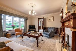 a living room with a couch and a table at Naughtons Villa in Killarney