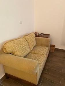 a couch sitting in a living room with at MiaDabia Supreme in Madaba