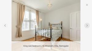 a bedroom with a bed and a window at St Mildreds Villa, Ramsgate Royal Harbour, Kent in Ramsgate